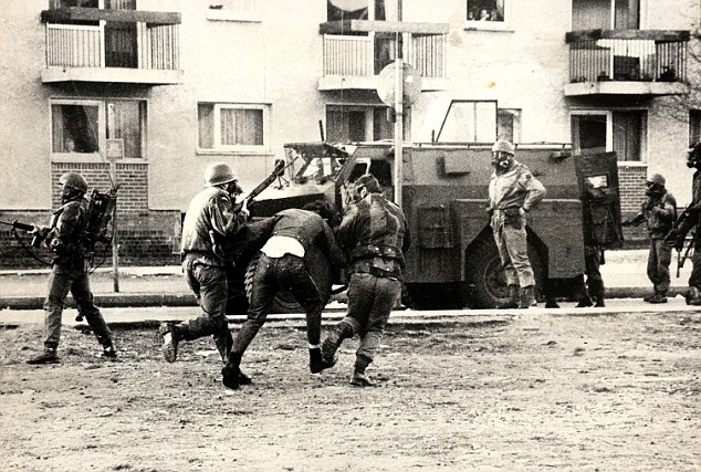 Forty-year controversy: Soldiers arrest a man on Bloody Sunday. Army chiefs have appealed to paratroopers involved to volunteer their names and addresses to a new investigation